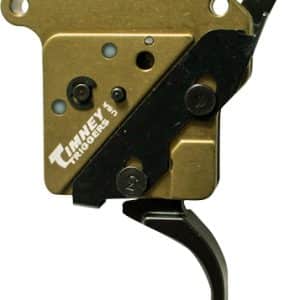 Rifle trigger mechanism with brass housing, black sear lever, and Timney Triggers branding.