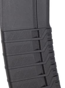 Black CMMG rifle magazine with orange follower and textured ridged body.