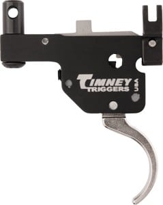 Close-up of a Timney Triggers firearm trigger mechanism in black housing with a silver curved trigger