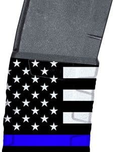 Firearm magazine wrapped in a black-and-white American flag with a blue Thin Blue Line stripe, seen from a tilted angle.