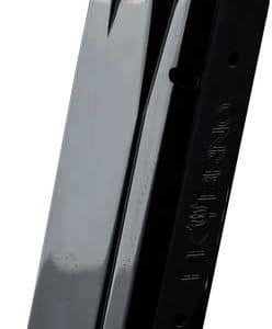 Close-up of a black metal pistol magazine standing upright, with shiny silver feed lips at the top.