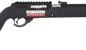 Long black rifle with an adjustable stock and extended barrel, featuring a labeled upgrade and front sight.