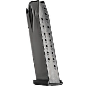 Metal handgun magazine with round count holes and numbers along the side, angled upright on a base plate