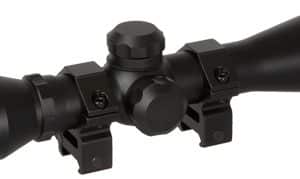 Black TRUGLO rifle scope with two mounting rings and long eyepiece, designed for mounting on a rifle rail (tactical optics)