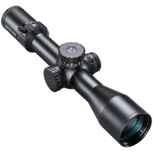 Black riflescope with multiple adjustment dials and a large objective lens, shown at an angle.