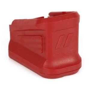 Red plastic clamp-like tool with a grooved side grip, shown from the side on a white background.