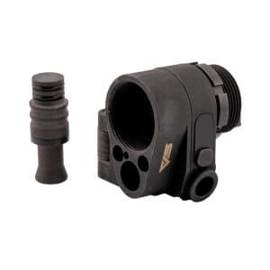 Black rifle optic mount with a circular opening and side attachment, shown with a separate rubber spacer nearby.