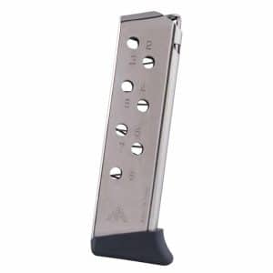 Metal handgun magazine with eight round slots, resting on a black base plate.
