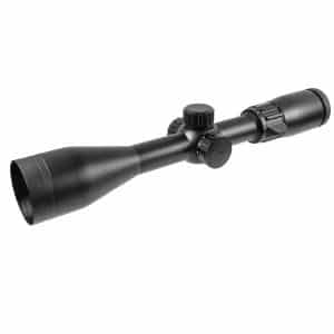 Black rifle scope with elevation and windage knobs, long tube, objective lens on one end and eyepiece on the other
