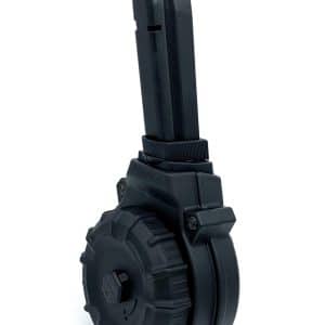 Side view of a black drum-style rifle magazine against a white background, showing the feed aperture and large wheel.