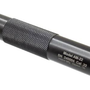 Knurled black .22 caliber firearm suppressor with two small end holes and model AM-22 inscription on the body.