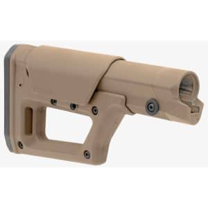 Close-up of a tan plastic rifle buttstock with mounting screws and a rubber recoil pad at the bottom left edge.
