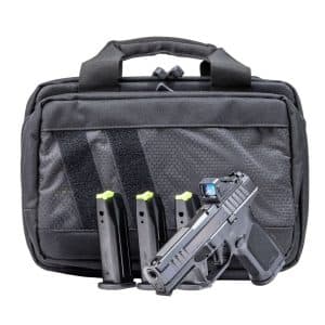 Black semi-automatic pistol with three magazines in a dark tactical bag's front pocket.