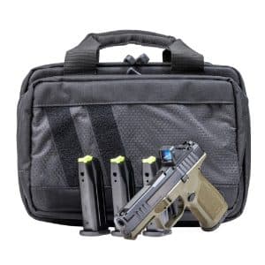 Black tactical bag with a semi-automatic pistol and four magazines visible in front pocket.