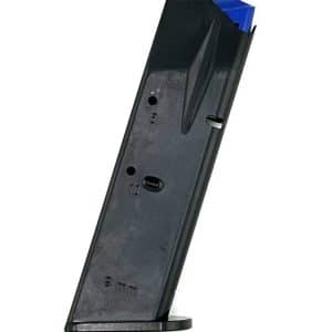 Black pistol magazine with a blue follower, tilted upright on a small stand against a white background.