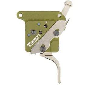 Compact green metal multitool or mechanical device with a folded metal blade and thumb lever, showing screws and holes for adjustment