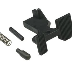 Disassembled small black plastic clamp with ribbed jaws, plus a metal coil spring and a few small pins/components.