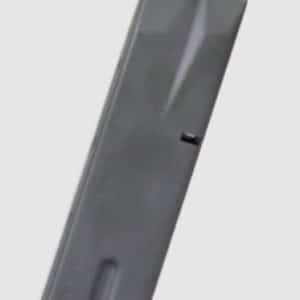 Gray pistol magazine standing upright against a light background.