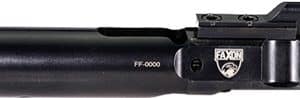 Close-up of a black rifle barrel/upper receiver with a front sight and top mounting rail, shown in profile.