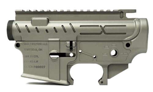 Lower receiver of an AR-style semi-automatic rifle shown in gray metal, with trigger housing visible.