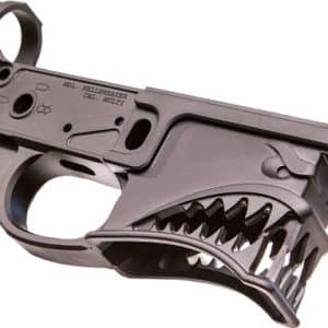 AR-style lower receiver featuring a decorative shark-teeth motif along the magazine well and trigger guard area