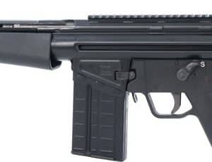 Side view of a black semi-automatic assault rifle with a detachable box magazine and Picatinny rails on top and a pistol grip