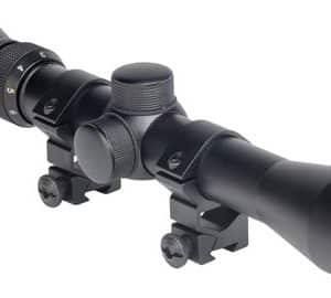Black riflescope with adjustable turrets and mounting rings, shown at an angle