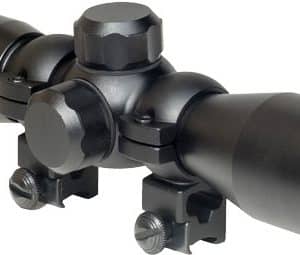 Black riflescope with two mounting rings and adjustment knobs viewed from the side