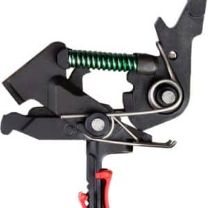 Close-up of a metal trigger clamp with a green coil spring and red handle, used to grip and hold objects.