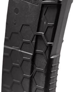 Black polymer handgun magazine with orange follower, standing upright showing hexagonal texture