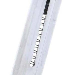 Close-up of a metal pistol magazine with a visible coil spring inside and feed lips at the top.
