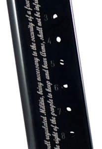 Black vertical display/stand with five numbered slots (1–5) along the edge, resting on a small base, and a white cursive quote printed along the side.
