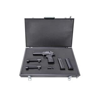 Open hard gun case containing a semi-automatic pistol, two magazines, and small accessories in foam inserts