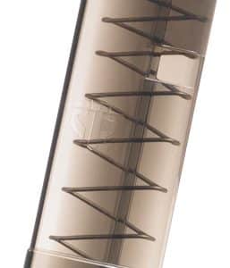 Transparent handgun magazine with visible coil spring and follower inside, empty of rounds, angled vertically.