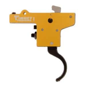 Yellow Timney rifle trigger assembly with a curved black trigger, side view