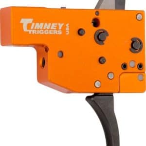 Orange Timney Triggers aftermarket rifle trigger assembly with a black curved trigger and adjustment screws, shown from the side.