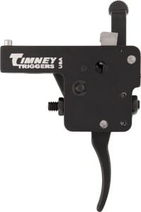 Black rectangular camera trigger release with a long curved lever and mounting screws, labeled 'Turney Triggers' on the side.