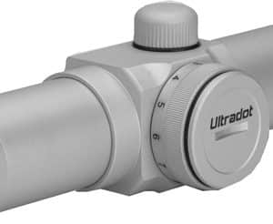 Silver riflescope with a large turret adjustment dial, front and rear lenses visible, used for aiming firearms