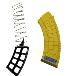 Disassembled curved yellow magazine and a black base plate with a metal spring.