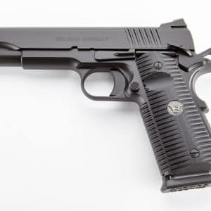 Side view of a Wilson Combat semi-automatic pistol with a textured grip and long rail, set against a white background.