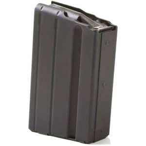Black detachable rifle magazine standing upright on a white background, metal finish and ribbed sides evident.