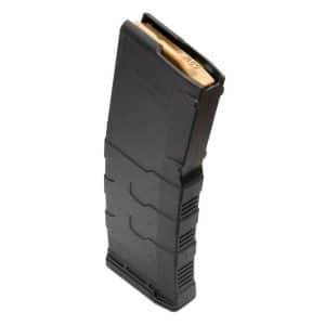 Black polymer rifle magazine standing upright with a visible gold follower at the top.