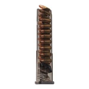 Transparent pistol magazine standing upright, loaded with copper-jacketed bullets
