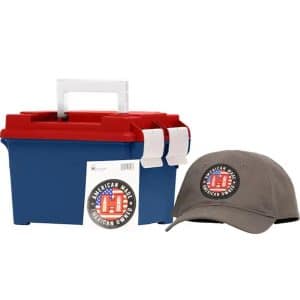 Blue cooler with red lid and white handles beside a gray baseball cap, both featuring an 'American Made, American Owned' logo sticker.