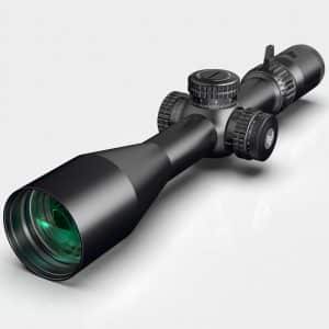 Telephoto rifle scope with adjustment dials and a green-tinted lens, viewed at an angle on a light background.