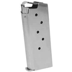 Metal pistol magazine with six witness holes along its side and a top feed lip, angled upright.