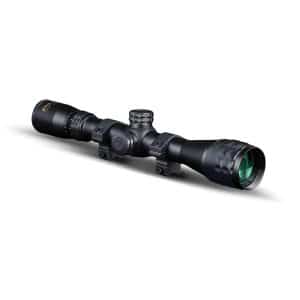 Black rifle scope with adjustment knobs and mounting rings on a white background