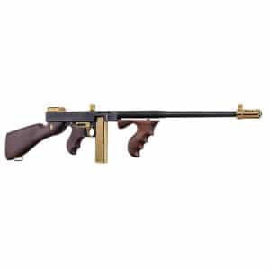 Lever-action rifle with dark wooden stock and gold-plated accents, long black barrel, and brass fittings.