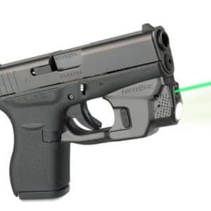 Black semi-automatic pistol with a green laser sight emitting a beam to the right.