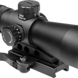 Black riflescope with adjustable turrets mounted on a rail, shown from the side.